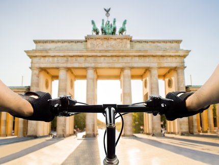 Cyclists in Berlin at the Brandenburg Gate